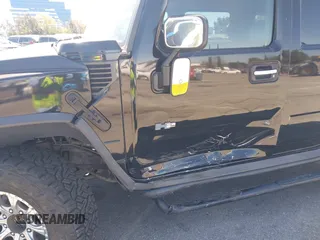 2003 Hummer H2 z VIN 5GRGN23U63H117676, wystawiony jako IAAI lot #41816411 z przebiegiem Nie podano mil oraz . Historia ofert i sprzedaży dostępna na DreamBid. Obrazek 6.