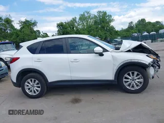 2014 Mazda CX-5 Touring z VIN JM3KE4CY9E0373359, wystawiony jako IAAI lot #42209277 z przebiegiem 106 493 mil mil oraz . Historia ofert i sprzedaży dostępna na DreamBid. Obrazek 14.