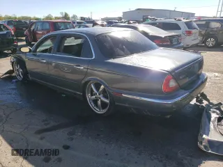2005 Jaguar XJ VDP with VIN SAJWA82C65SG42753, listed as a Copart auction lot 73792534 with 141,936 mi miles and Salvage Title. Bid and sale history available at carsss.com. Image 2.