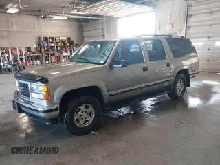 1999 GMC Suburban with VIN 3GKFK16R7XG549530, listed as a IAAI auction lot 41778323 with 174,866 mi miles. Bid and sale history available at carsss.com. Image 2.