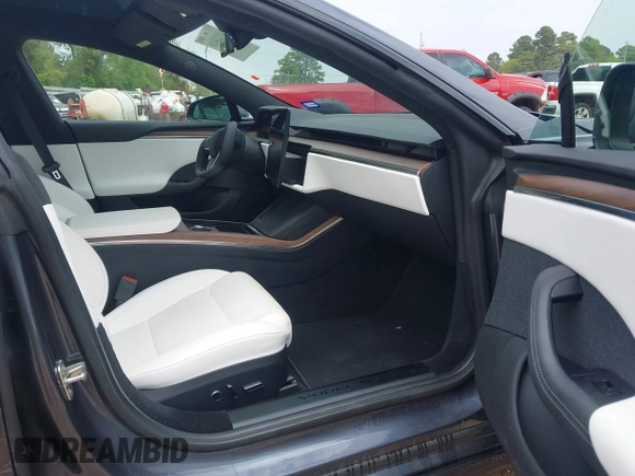 2023 Tesla Model S with VIN 5YJSA1E53PF511231, listed as a IAAI auction lot 41924626 with Not provided miles and . Bid and sale history available at DreamBid. Image 5.