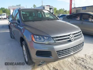 2011 Volkswagen Touareg Sport with VIN WVGFF9BP7BD000253, listed as a IAAI auction lot 41512125 with 152,711 mi miles and . Bid and sale history available at DreamBid. Image 1.
