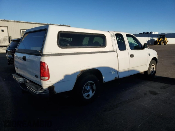 2000 Ford F-150 with VIN 1FTRX17W8YKB11043, listed as a Copart auction lot 77390664 with 181,439 mi miles and Salvage Title. Bid and sale history available at DreamBid. Image 3.