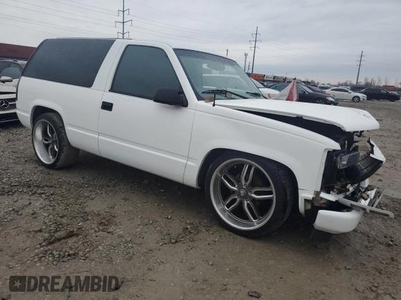 1997 GMC Yukon with VIN 3GKEC18R0VG523581, listed as a Copart auction lot 79601454 with 184,548 mi miles and Salvage Title. Bid and sale history available at carsss.com. Image 4.
