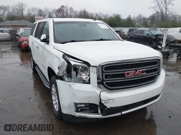 2015 GMC Yukon XL SLT with VIN 1GKS1HKC7FR223513, listed as a IAAI auction lot 40822575 with 128,239 mi miles. Bid and sale history available at carsss.com. Image 1.
