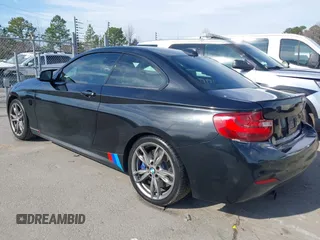 2015 BMW 2 Series M235i with VIN WBA1J7C55FV358964, listed as a IAAI auction lot 41674800 with 63,504 mi miles and . Bid and sale history available at carsss.com. Image 3.