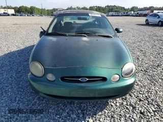 1999 Ford Taurus SE with VIN 1FAFP53U2XG184723, listed as a Copart auction lot 60787115 with 128,277 mi miles and Salvage title. Bid and sale history available at DreamBid. Image 5.