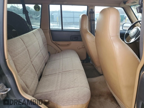 1997 Jeep Cherokee SE with VIN 1J4FJ28S5VL551419, listed as a Copart auction lot 42241185 with 239,699 mi miles and Salvage Title. Bid and sale history available at carsss.com. Image 11.