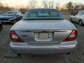 2005 Jaguar XJ with VIN SAJWA79C55SG37981, listed as a Copart auction lot 81142484 with 128,601 mi miles and Salvage Title. Bid and sale history available at carsss.com. Image 6.