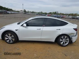 2021 Tesla Model Y Long Range with VIN 5YJYGDEE6MF122363, listed as a IAAI auction lot 41952018 with 54,263 mi miles and . Bid and sale history available at carsss.com. Image 14.
