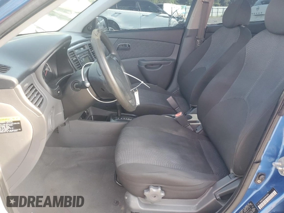 2009 Kia Rio LX with VIN KNADE223296515613, listed as a Copart auction lot 62008194 with 143,238 mi miles and Salvage Title. Bid and sale history available at carsss.com. Image 7.