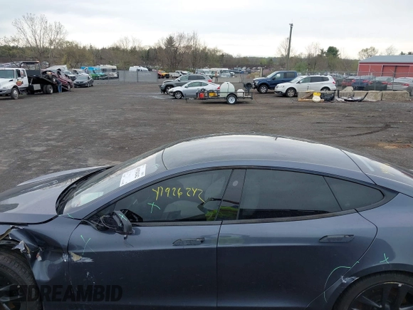 2021 Tesla Model S Long Range with VIN 5YJSA1E5XMF428519, listed as a IAAI auction lot 41926242 with 54,284 mi miles and . Bid and sale history available at DreamBid. Image 14.