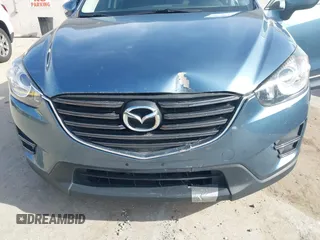 2016 Mazda CX-5 Sport with VIN JM3KE4BY0G0746034, listed as a IAAI auction lot 41842894 with 92,801 mi miles. Bid and sale history available at carsss.com. Image 6.