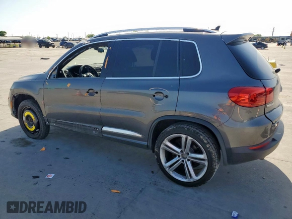 2014 Volkswagen Tiguan SEL z VIN WVGAV3AX6EW030705, wystawiony jako Copart lot #52156805 z przebiegiem 142 377 mil mil oraz Szkoda całkowita • Salvage title. Historia ofert i sprzedaży dostępna na DreamBid. Obrazek 2.