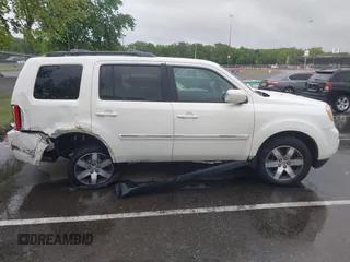 2013 Honda Pilot Touring with VIN 5FNYF4H96DB016044, listed as a IAAI auction lot 42314590 with 183,913 mi miles and . Bid and sale history available at DreamBid. Image 13.