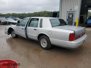 1997 Lincoln Town Car Executive with VIN 1LNLM81W1VY719314, listed as a Copart auction lot 73950324 with 0 mi miles and Salvage Title. Bid and sale history available at carsss.com. Image 2.