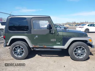 2006 Jeep Wrangler SE with VIN 1J4FA29116P763914, listed as a IAAI auction lot 42140140 with 107,161 mi miles. Bid and sale history available at carsss.com. Image 14.