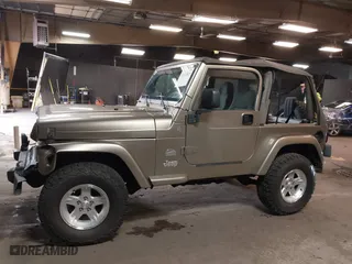 2004 Jeep Wrangler Sahara with VIN 1J4FA59S64P736389, listed as a IAAI auction lot 41432819 with 102,830 mi miles. Bid and sale history available at carsss.com. Image 14.