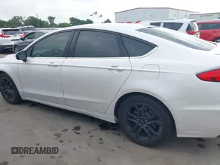 2020 Ford Fusion SE with VIN 3FA6P0HD7LR148007, listed as a IAAI auction lot 42132944 with 63,328 mi miles and . Bid and sale history available at DreamBid. Image 14.