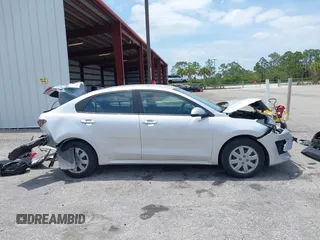 2023 Kia Rio S z VIN 3KPA24AD4PE604207, wystawiony jako IAAI lot #42077201 z przebiegiem 16 559 mil mil oraz . Historia ofert i sprzedaży dostępna na DreamBid. Obrazek 13.