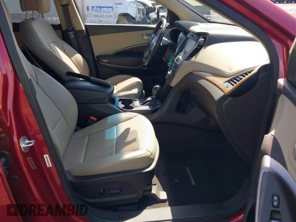 2014 Hyundai Santa Fe z VIN 5XYZUDLB3EG226857, wystawiony jako IAAI lot #41917762 z przebiegiem 42 677 mil mil oraz . Historia ofert i sprzedaży dostępna na DreamBid. Obrazek 5.