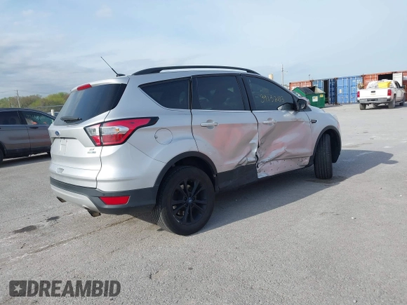 2018 Ford Escape SE z VIN 1FMCU9GD6JUC91365, wystawiony jako IAAI lot #39152113 z przebiegiem 129 283 mil mil oraz . Historia ofert i sprzedaży dostępna na DreamBid. Obrazek 4.