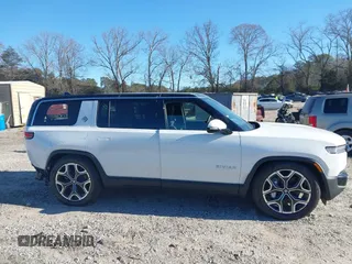 2025 Rivian R1S Adventure with VIN 7PDSGBBA0SN049154, listed as a IAAI auction lot 41160166 with 3,036 mi miles. Bid and sale history available at carsss.com. Image 13.