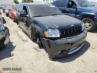 2007 Jeep Grand Cherokee SRT-8 with VIN 1J8HR78387C603473, listed as a Copart auction lot 57712964 with 114,429 mi miles and Salvage Title. Bid and sale history available at carsss.com. Image 4.