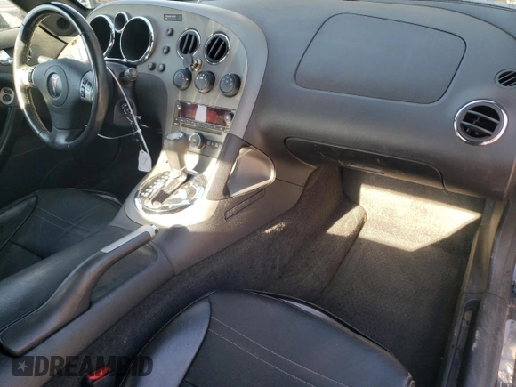 2009 Pontiac Solstice GXP z VIN 1G2MT35X19Y105245, wystawiony jako Copart lot #89054685 z przebiegiem 141 283 mil mil oraz Szkoda całkowita • Salvage title. Historia ofert i sprzedaży dostępna na DreamBid. Obrazek 8.