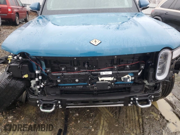 2024 Rivian R1S Adventure z VIN 7PDSGABA1RN031444, wystawiony jako Copart lot #43312765 z przebiegiem Nie podano mil oraz Szkody całkowita. Historia ofert i sprzedaży dostępna na DreamBid. Obrazek 12.