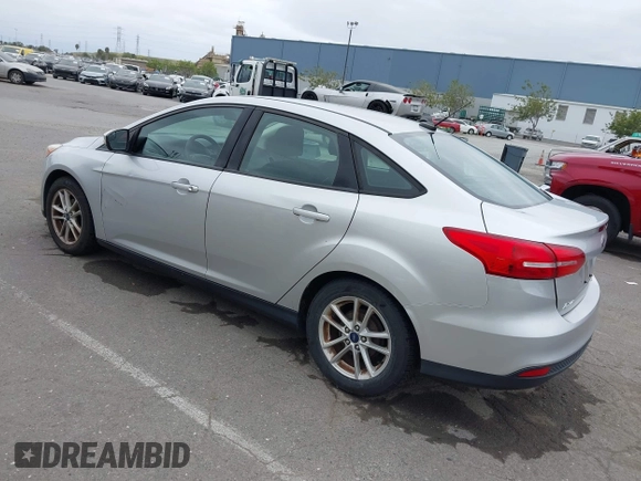 2015 Ford Focus SE z VIN 1FADP3F21FL218369, wystawiony jako IAAI lot #42126986 z przebiegiem 99 844 mil mil oraz . Historia ofert i sprzedaży dostępna na DreamBid. Obrazek 3.