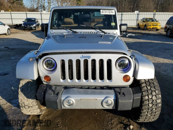 2011 Jeep Wrangler Sahara with VIN 1J4GA5D14BL628876, listed as a Copart auction lot 87317374 with 84,179 mi miles and Salvage Title. Bid and sale history available at DreamBid. Image 5.