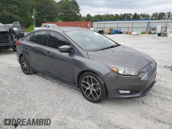 2018 Ford Focus SE z VIN 1FADP3FE1JL220741, wystawiony jako Copart lot #53755735 z przebiegiem Nie podano mil oraz Czysty tytuł • Clean title. Historia ofert i sprzedaży dostępna na DreamBid. Obrazek 4.