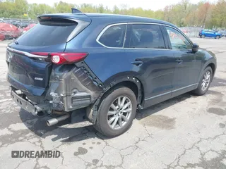 2019 Mazda CX-9 Touring z VIN JM3TCBCY6K0331905, wystawiony jako IAAI lot #42157842 z przebiegiem 84 211 mil mil oraz . Historia ofert i sprzedaży dostępna na DreamBid. Obrazek 4.