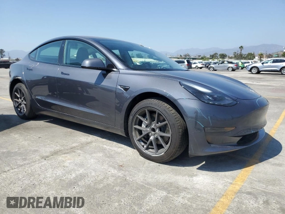 2023 Tesla Model 3 with VIN 5YJ3E1EA3PF695267, listed as a Copart auction lot 52559645 with 9,025 mi miles and Salvage title. Bid and sale history available at DreamBid. Image 4.