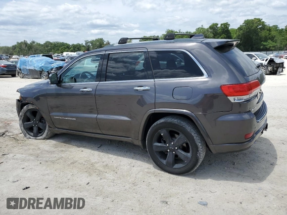 2014 Jeep Grand Cherokee Overland with VIN 1C4RJFCT7EC182234, listed as a Copart auction lot 54754465 with 185,658 mi miles and Salvage Title. Bid and sale history available at DreamBid. Image 2.