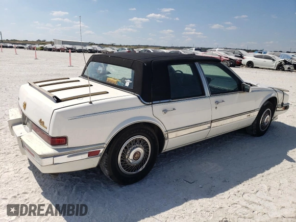 1991 Cadillac Seville z VIN 1G6KS53B9MU824142, wystawiony jako Copart lot #74276264 z przebiegiem 103 517 mil mil oraz Szkody całkowita. Historia ofert i sprzedaży dostępna na DreamBid. Obrazek 3.