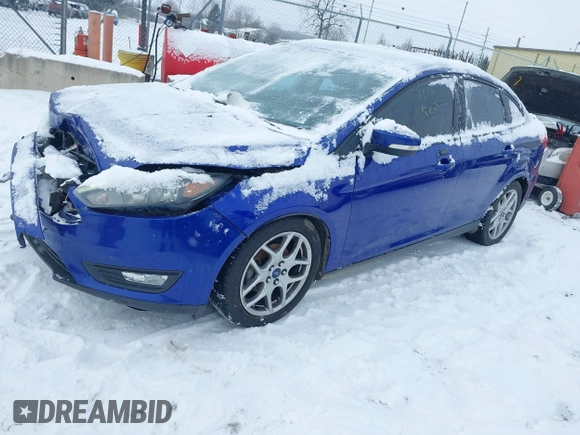 2015 Ford Focus SE with VIN 1FADP3F23FL361274, listed as a IAAI auction lot 41292796 with 102,741 mi miles. Bid and sale history available at carsss.com. Image 2.