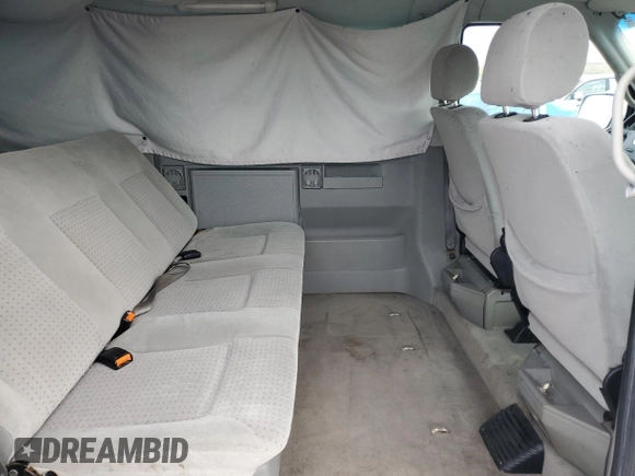 2000 Volkswagen EuroVan с VIN WV2MH4701YH035166, выставлен на аукционе Copart как лот 55680175 с пробегом 220 080 миль миль и Чистый • Clean title. История ставок и продаж доступна на DreamBid. Изображение 11.