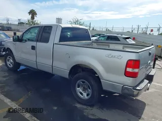 2007 Ford F-150 STX with VIN 1FTRX14W87KC40659, listed as a IAAI auction lot 41423345 with 145,811 mi miles. Bid and sale history available at carsss.com. Image 3.