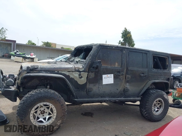 2016 Jeep Wrangler Unlimited Sahara z VIN 1C4HJWEG4GL261147, wystawiony jako IAAI lot #42239252 z przebiegiem 69 604 mil mil oraz . Historia ofert i sprzedaży dostępna na DreamBid. Obrazek 14.