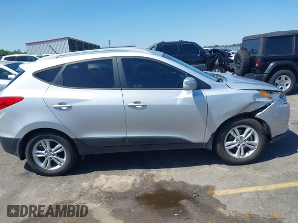 2013 Hyundai Tucson GLS with VIN KM8JU3AC3DU551018, listed as a IAAI auction lot 41988305 with 214,728 mi miles. Bid and sale history available at carsss.com. Image 13.