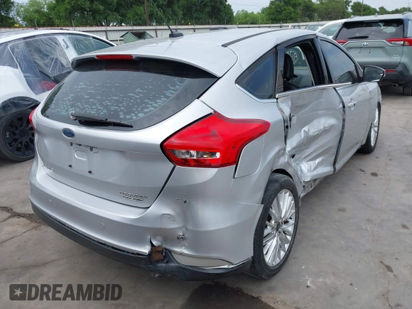 2015 Ford Focus Titanium with VIN 1FADP3N23FL356822, listed as a IAAI auction lot 41981053 with 115,584 mi miles and . Bid and sale history available at DreamBid. Image 4.