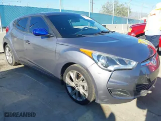 2016 Hyundai Veloster with VIN KMHTC6AD3GU283985, listed as a IAAI auction lot 41872103 with 153,949 mi miles. Bid and sale history available at carsss.com. Image 1.