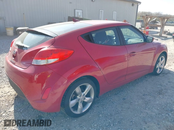2014 Hyundai Veloster with VIN KMHTC6AD2EU214847, listed as a IAAI auction lot 42067728 with 77,421 mi miles. Bid and sale history available at carsss.com. Image 4.