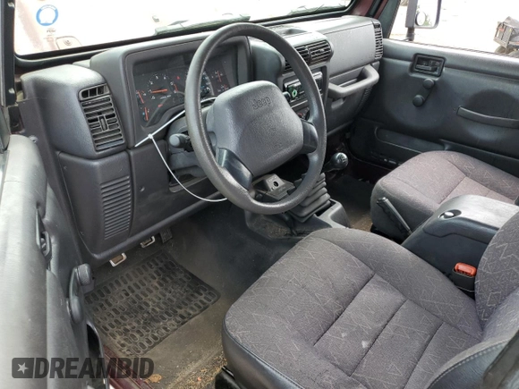 2002 Jeep Wrangler X z VIN 1J4FA39S42P773815, wystawiony jako Copart lot #60016255 z przebiegiem 174 803 mil mil oraz Szkoda całkowita • Salvage title. Historia ofert i sprzedaży dostępna na DreamBid. Obrazek 8.
