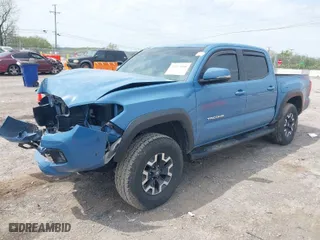 2019 Toyota Tacoma 4WD SR with VIN 3TMCZ5AN0KM260201, listed as a IAAI auction lot 42017048 with 49,216 mi miles. Bid and sale history available at carsss.com. Image 2.