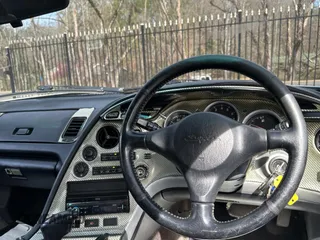 1993 Toyota Supra с VIN JZA800010229, выставлен на аукционе Copart как лот 50000065 с пробегом 130 612 миль миль и Чистый • Clean title. История ставок и продаж доступна на DreamBid. Изображение 9.