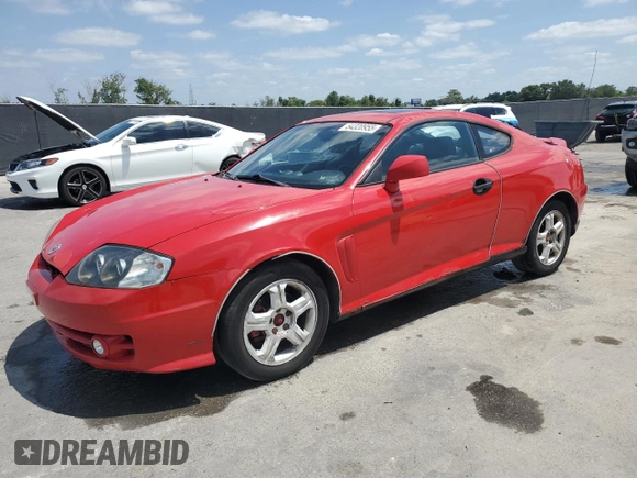 2003 Hyundai Tiburon GT z VIN KMHHN65F33U088538, wystawiony jako Copart lot #54320955 z przebiegiem 220 732 mil mil oraz Szkoda całkowita • Salvage title. Historia ofert i sprzedaży dostępna na DreamBid. Obrazek 1.