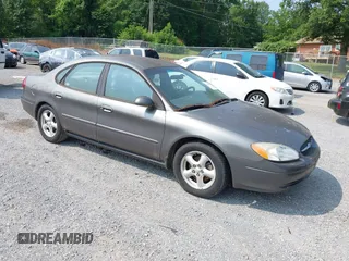 2002 Ford Taurus SE Standard z VIN 1FAFP53U42A101370, wystawiony jako IAAI lot #42469376 z przebiegiem 149 111 mil mil oraz . Historia ofert i sprzedaży dostępna na DreamBid. Obrazek 1.